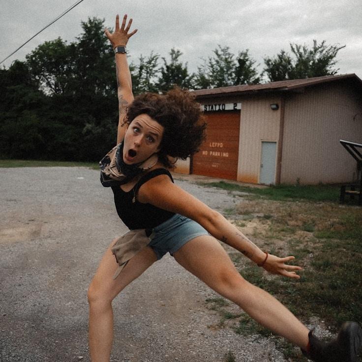Ari Kapoor, Lead Design Curator at Shine Haven Atelier, reviewing corporate floral arrangements